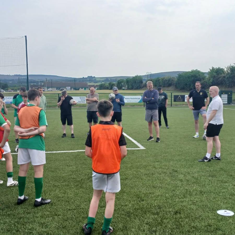 Trevor Casey working with a group of players